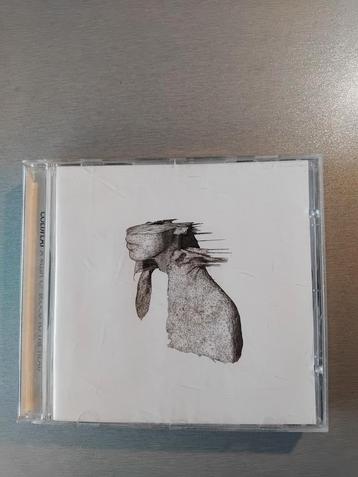 CD. Coldplay. Une coulée de sang sur la tête.