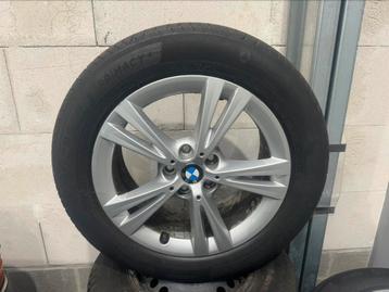 Nieuwe banden met velg bmw zeer goede staat 