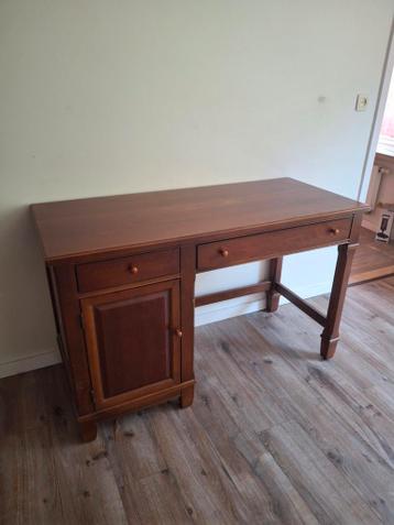 Desk. To quickly give away. In front of building