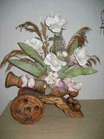 Houten kanon versiert met bloemen, Ophalen