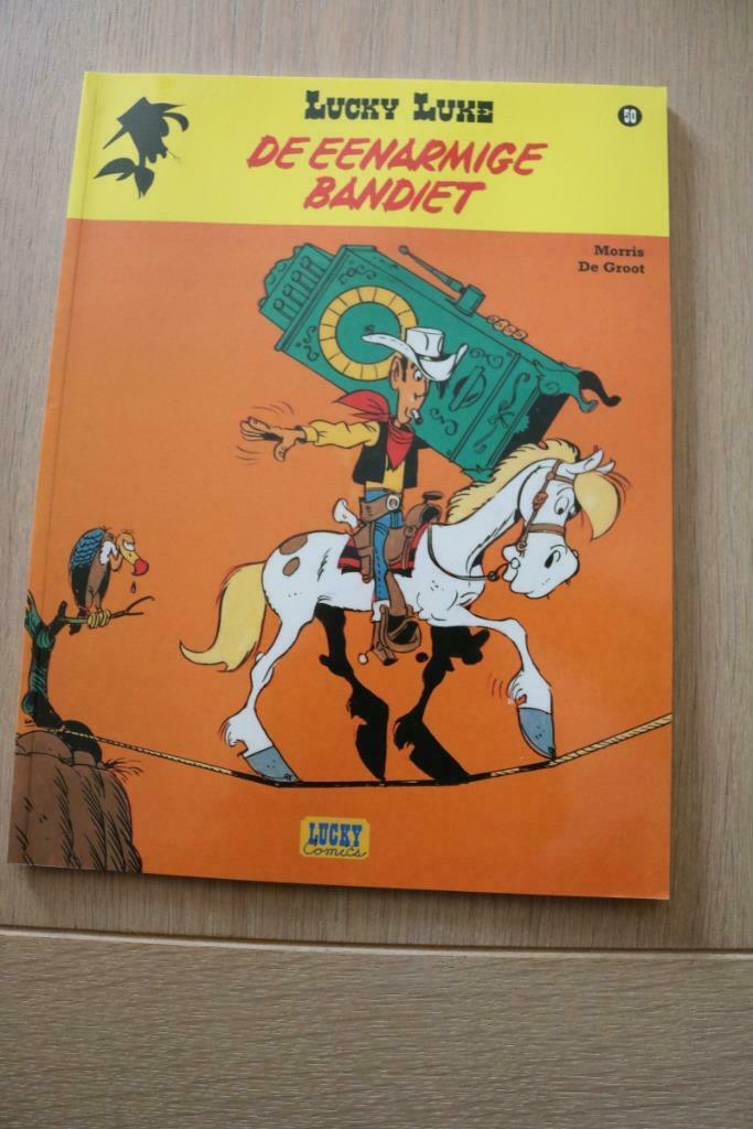Lucky Luke 50 : De eenarmige bandiet 1e druk heruitgave 2016, Boeken, Stripverhalen, Nieuw, Eén stripboek, Ophalen of Verzenden