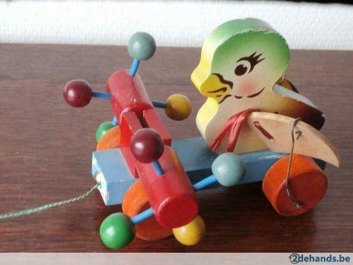 Antiek speelgoed:trekkertje:Eendje met draaimolen