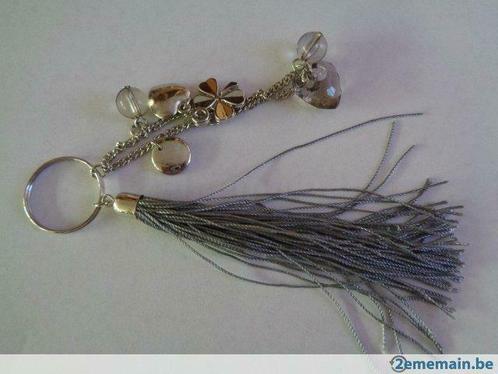 Porte-clés Grigri. Gris., Verzamelen, Sleutelhangers, Nieuw, Ophalen of Verzenden