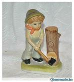 statue garçonnet bucheron