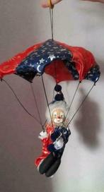 Poupée de porcelaine clown parachute, Enlèvement