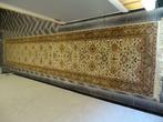 handgeknoopt tapijt uit India, Ophalen