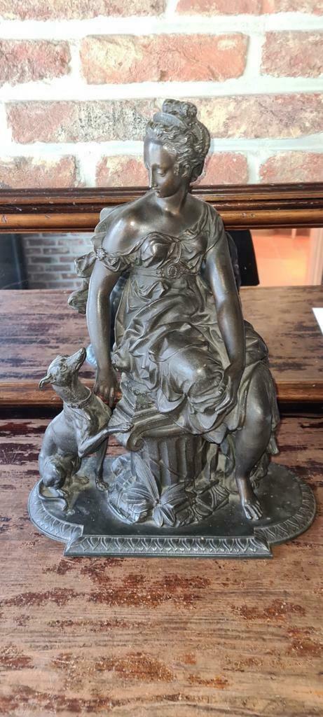 beeld dame met hond in zamak, Ophalen