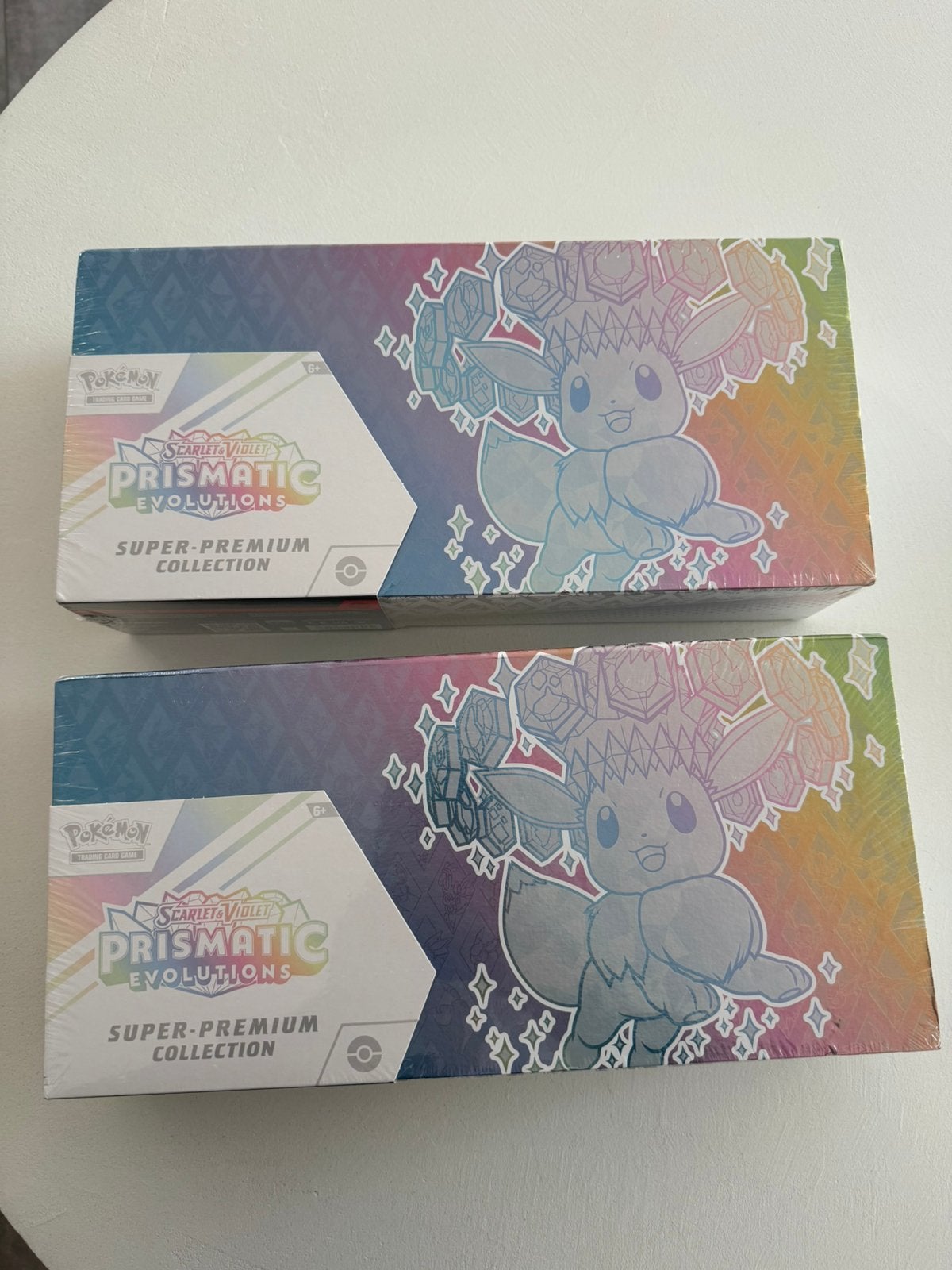 Prismatic super premium collection!, Ophalen, Nieuw, Boosterbox, Foil