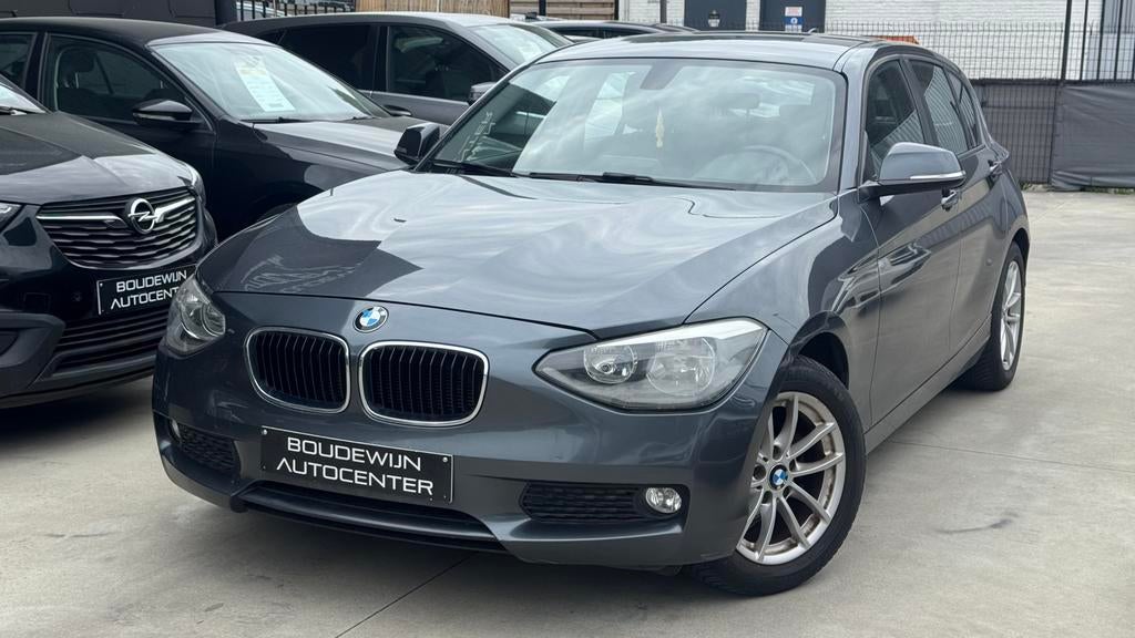 Bmw 1 Serie 1.6Benzine AUTOMAAT 2011 170.xxxkm Topstaat, Auto's, BMW, Automaat, Zwart, 5 deurs, https://public.car-pass.be/vhr/61240180-234f-4c4d-94f5-52f9d5f55593