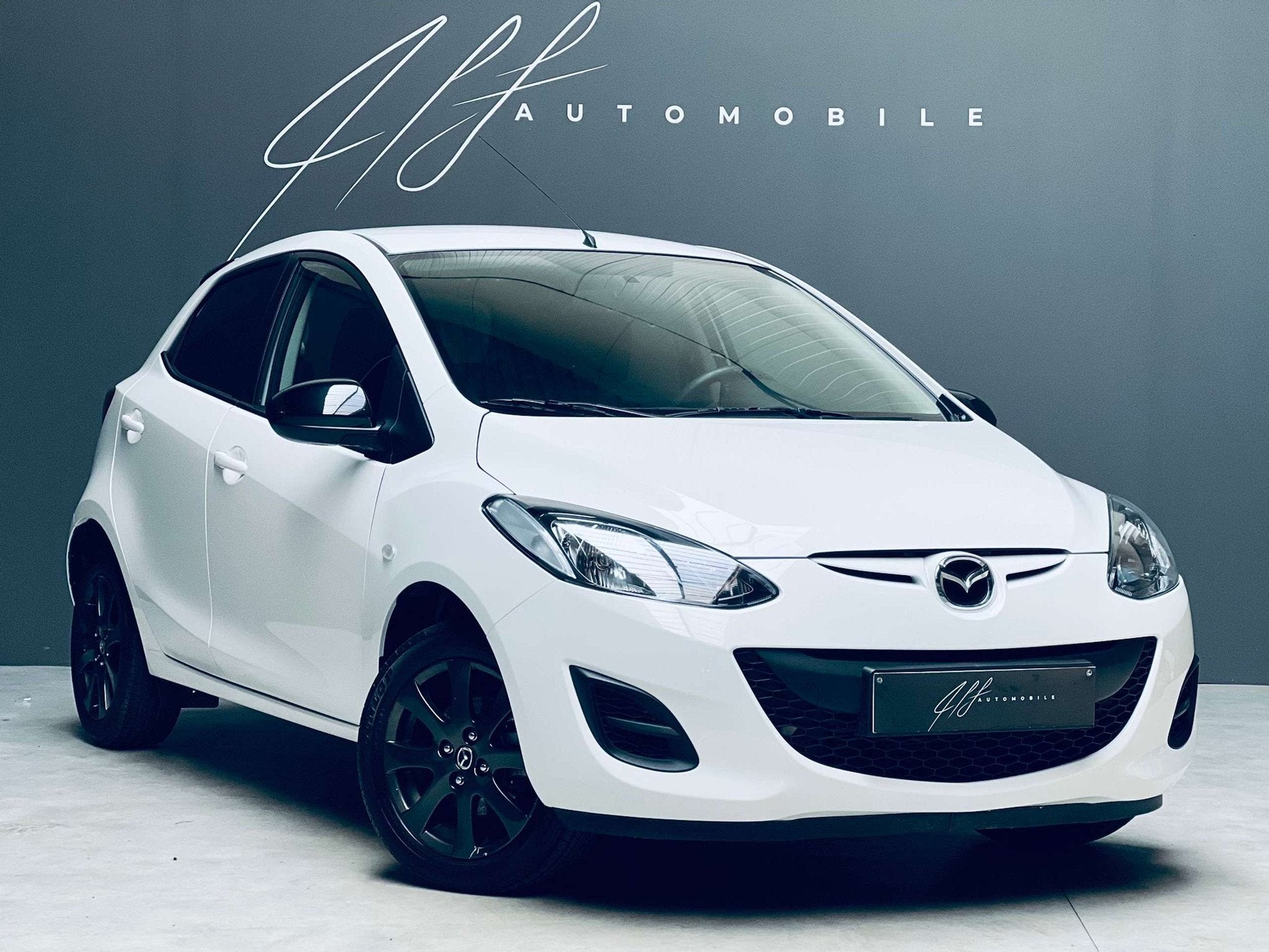 Mazda 2 1.3i *CLIMATISATION*GARANTIE* (bj 2014), Auto's, Voorwielaandrijving, Euro 5, Stof, Zwart