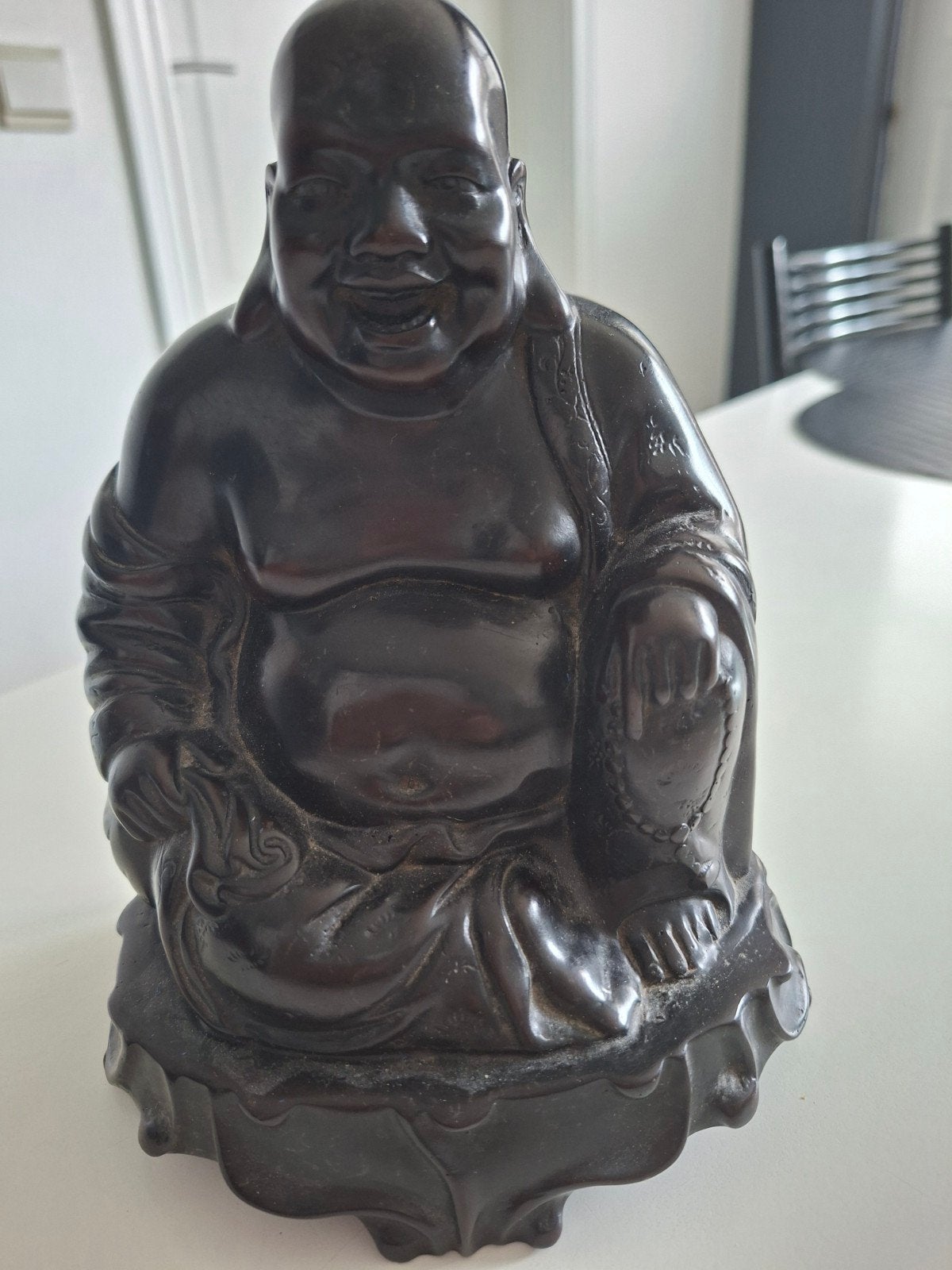 Lachende Boedha, Ophalen, Zwart