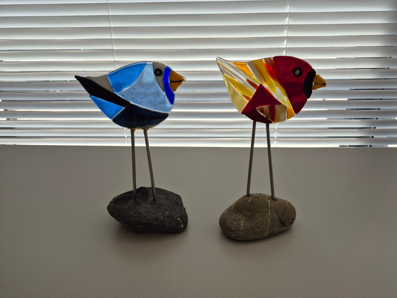 2 glazen vogeltjes, Ophalen