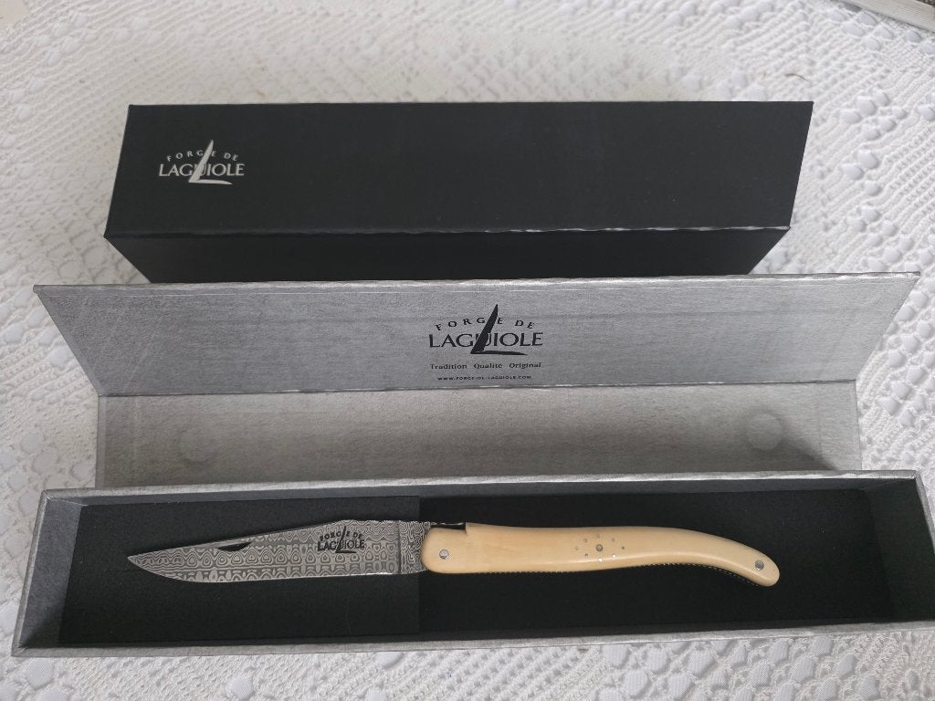 Laguiole couteau pliant ivoire de mammouth, Enlèvement, Utilisé