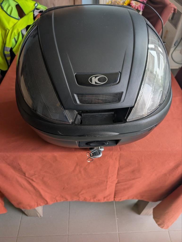Topkoffer kymco, Ophalen