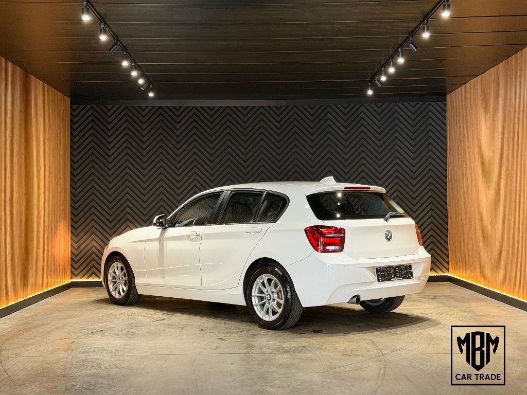✅ BMW 114 i 12 Maanden GARANTIE Navi Zetelverw. Parksensoren, Autos, 75 kW, Achat, Euro 6, Entreprise