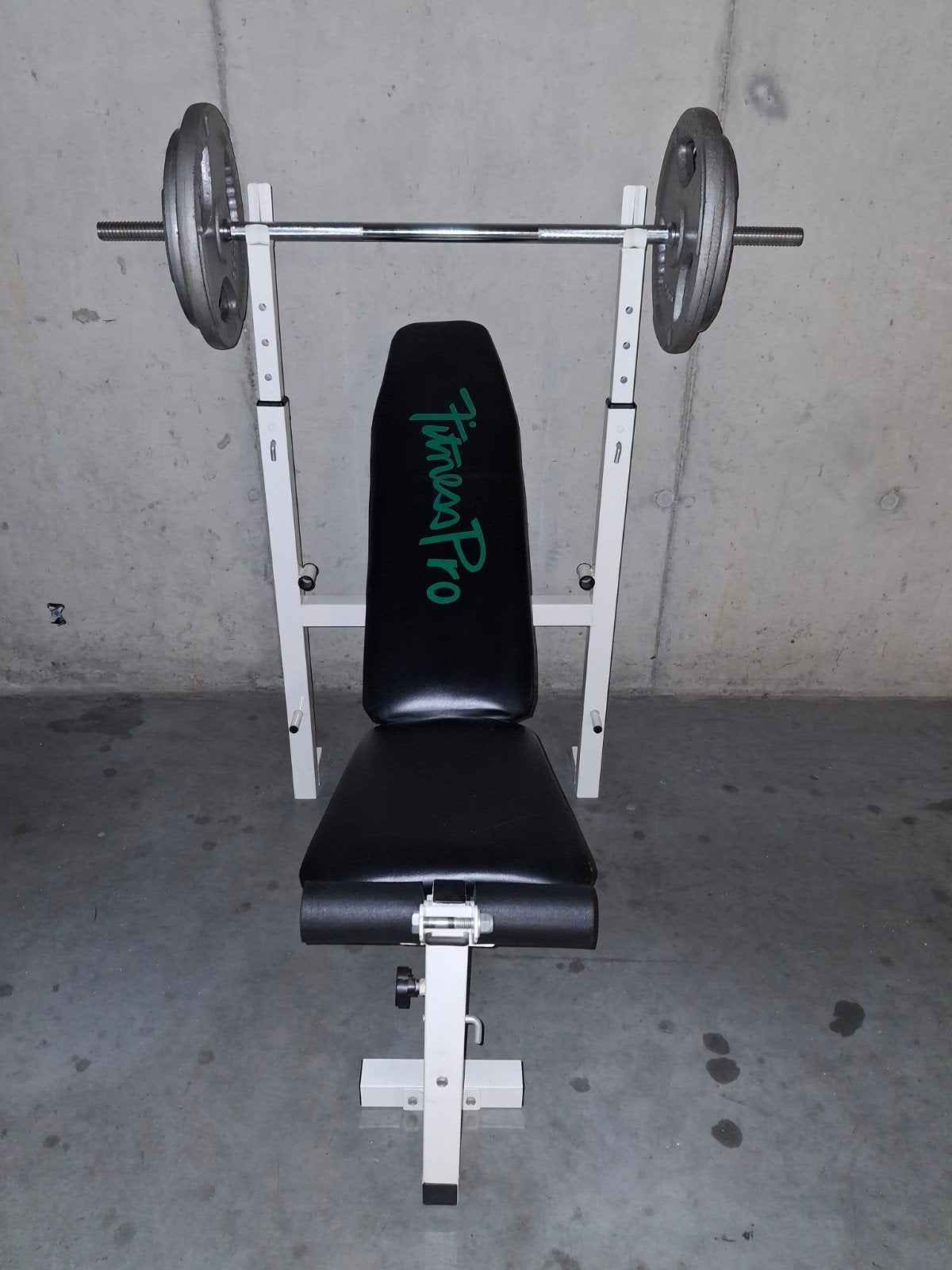 Halterbank met 67kg gewichten, Ophalen