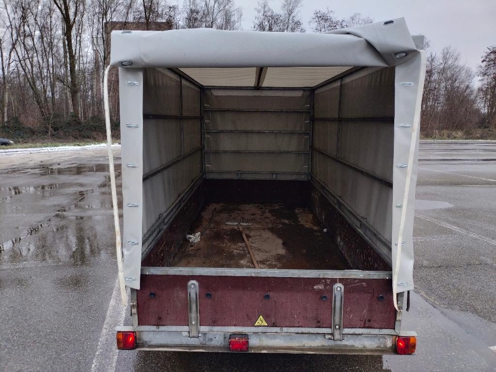 Geremde dubbelas aanhangwagen met nieuwe huif., Ophalen