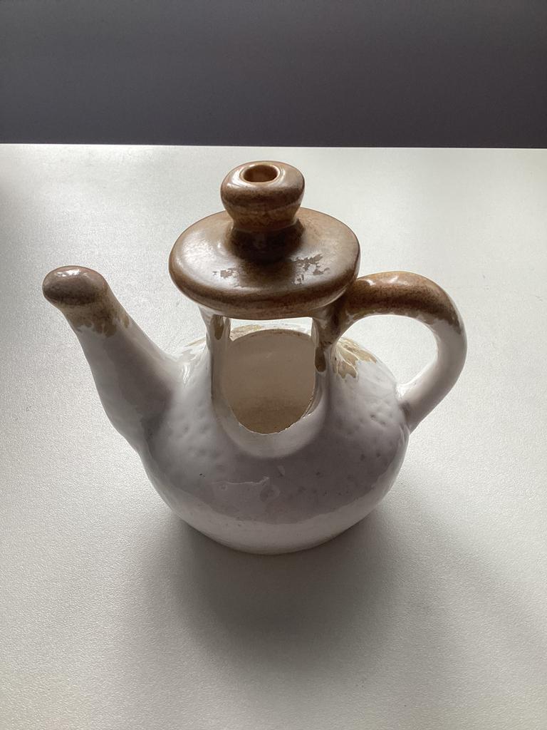 Plantenhanger in de vorm van een theepot, Enlèvement