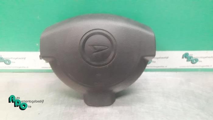Airbag gauche (volant) d'un Daihatsu Cuore (Cuore 03-), Daihatsu, -, 3 mois de garantie, Utilisé
