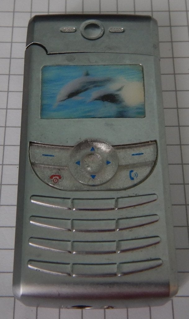 Briquet  " GSM aux dauphins " au gaz en bon état., Collections, Enlèvement ou Envoi, Briquet