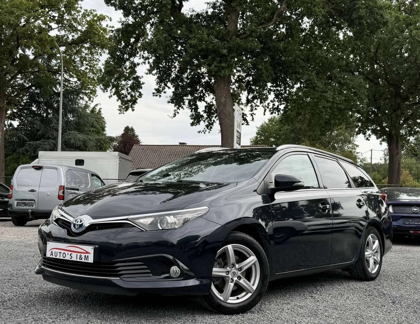 Toyota Auris SW HEV 1.8i HSD Dynamic E-CVT Camera Garantie!, Auto's, Toyota, Automaat, Stof, 4 cilinders, Lichtsensor