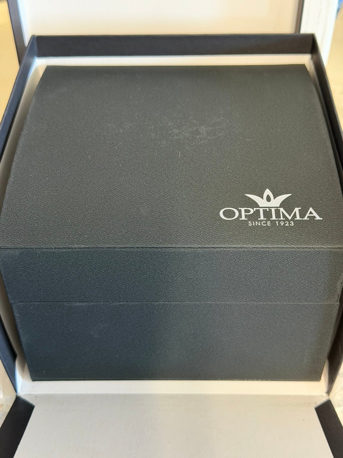 Optima swiss made quarz, Enlèvement ou Envoi, Comme neuf, Acier, Cuir