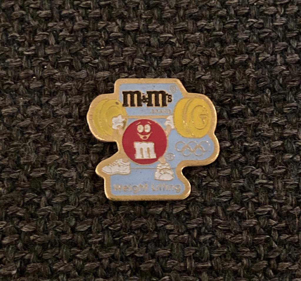 PIN - M&M'S - OLYMPISCHE SPELEN - WEIGHT LIFTING, Verzenden, Gebruikt, Sport, Speldje of Pin