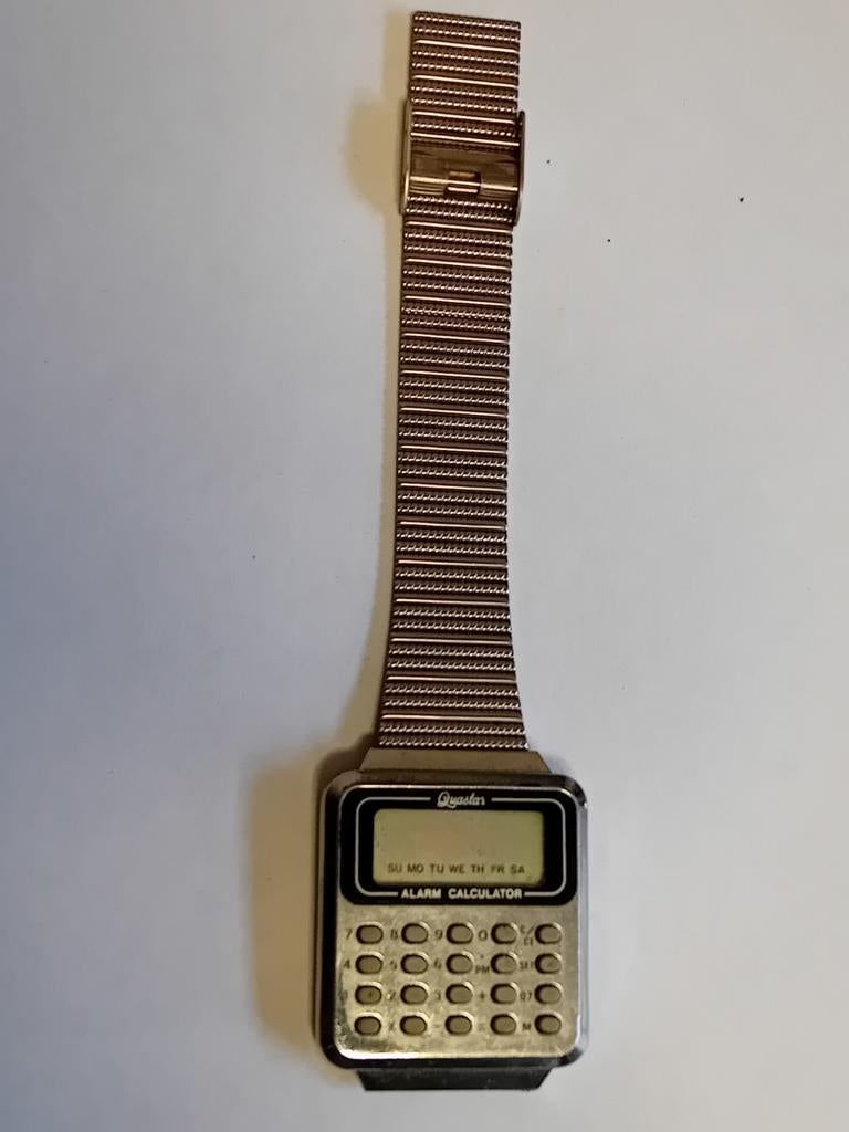 Montre Quastar calculatrice vintage, Montre-bracelet, Autres marques, Enlèvement ou Envoi, Acier