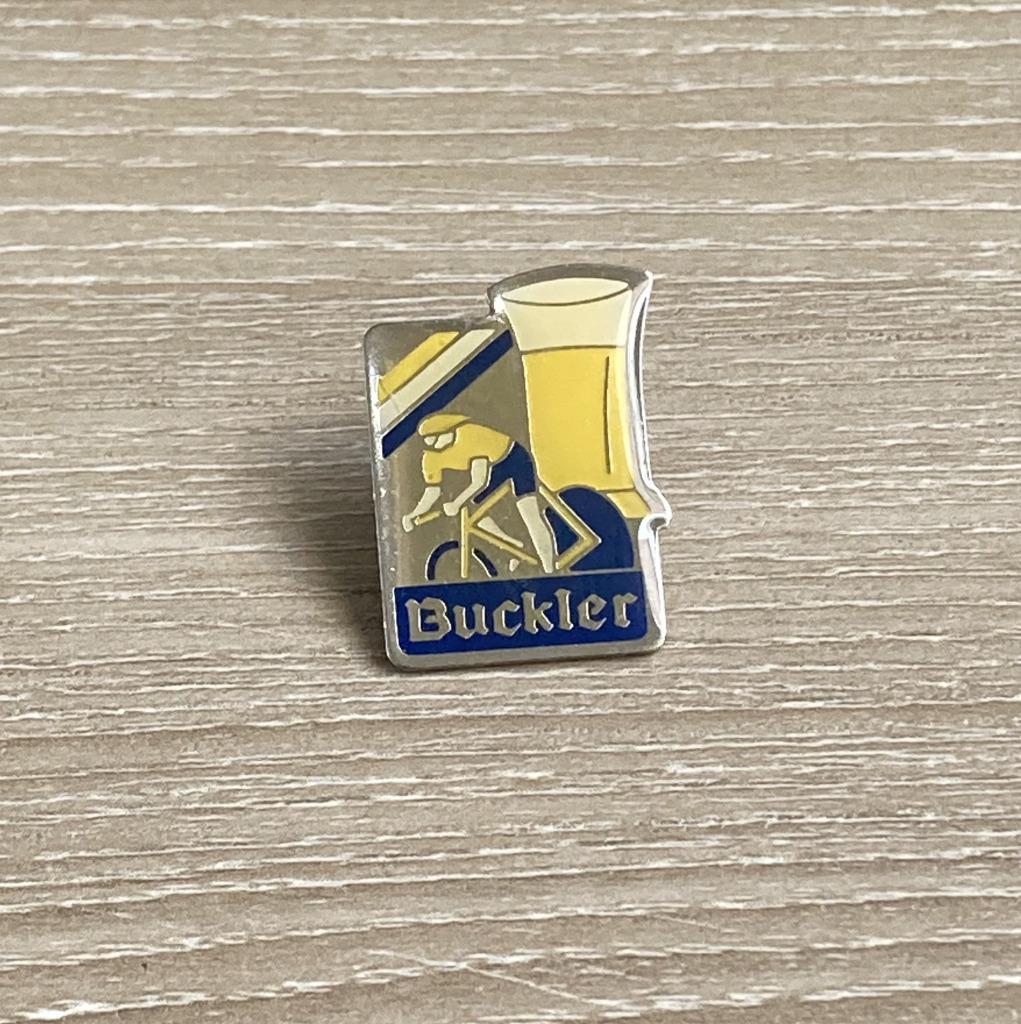 PIN - BUCKLER - BIER - BIÈRE - BEER - WIELRENNEN, Envoi, Utilisé, Marque, Insigne ou Pin's