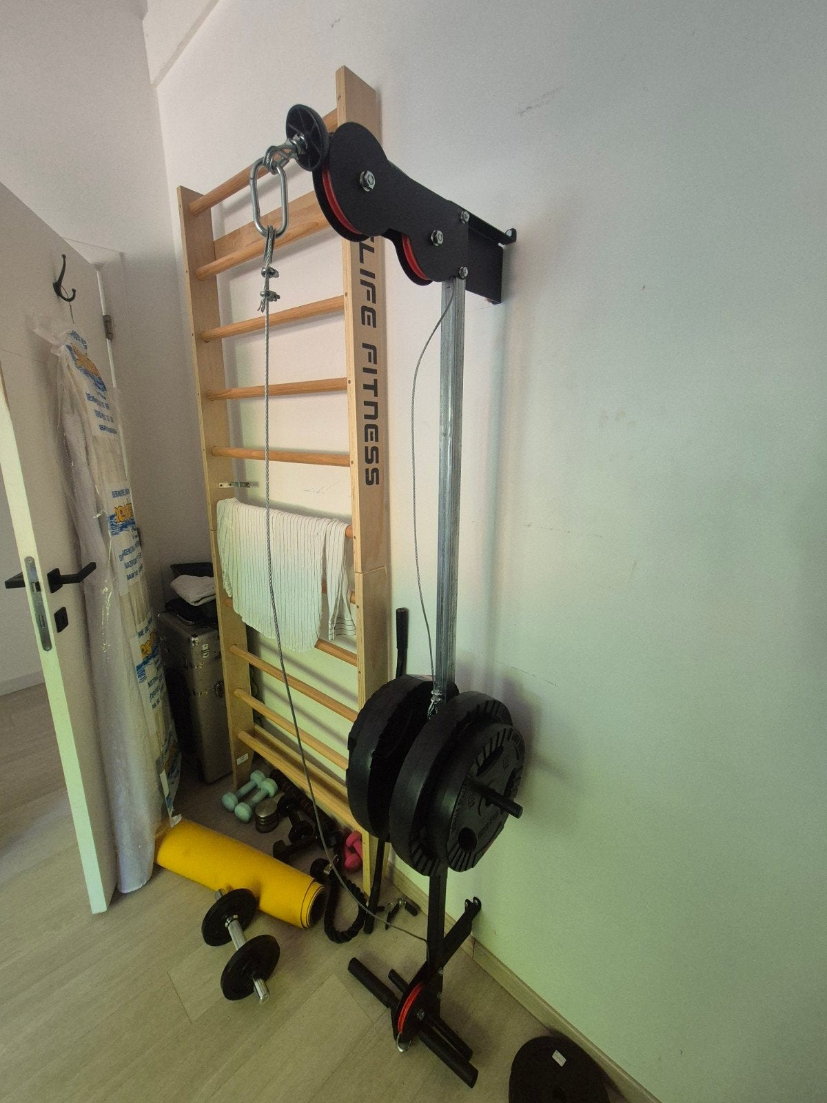 Latt pulley fitness toestel, Ophalen
