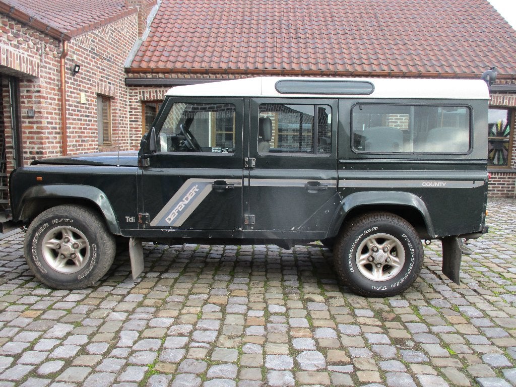 land rover  defender   b,j 2004, Auto's, Stof, 7 zetels, Defender, Particulier
