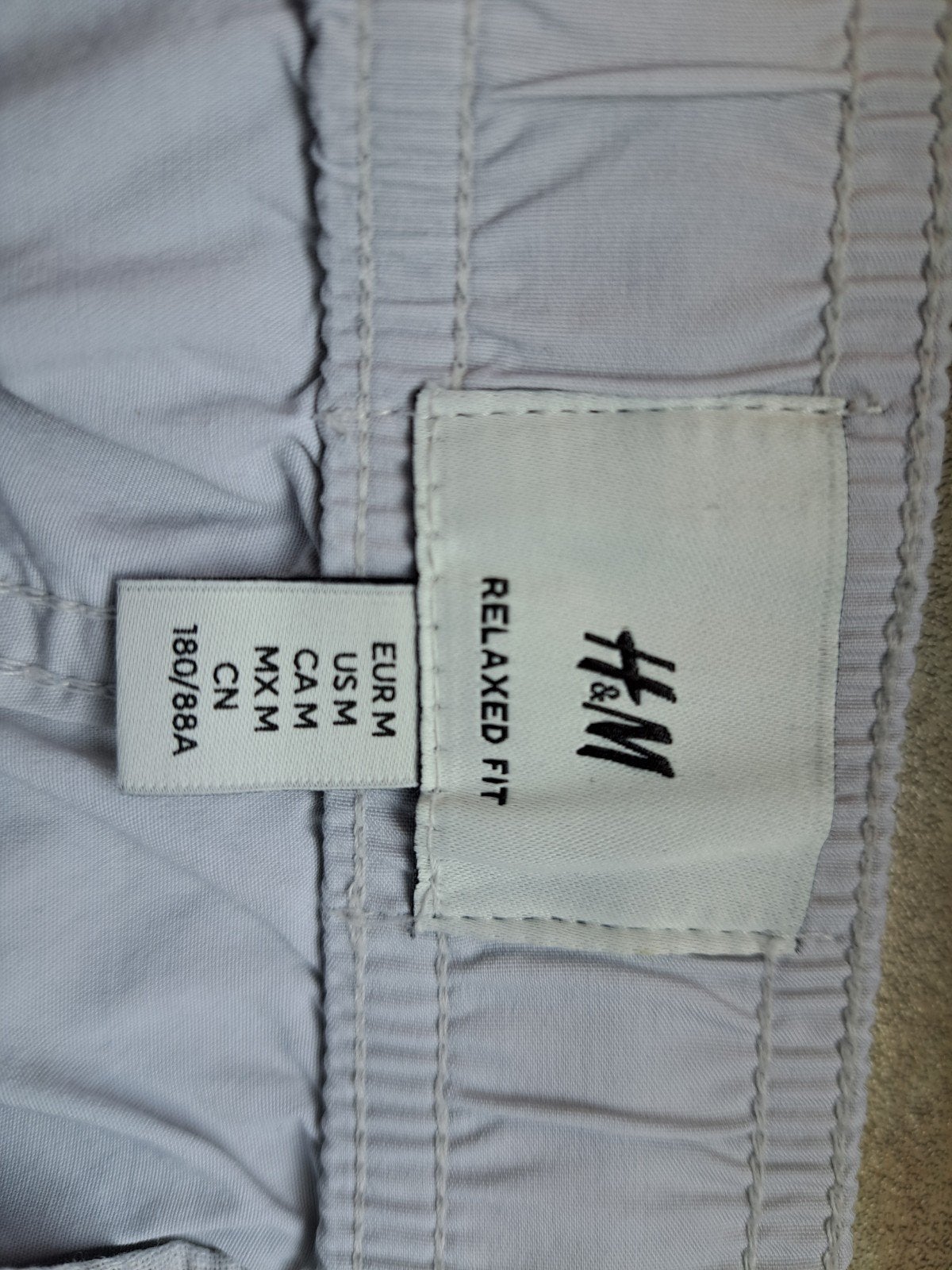 broek lichtgrijs, Ophalen