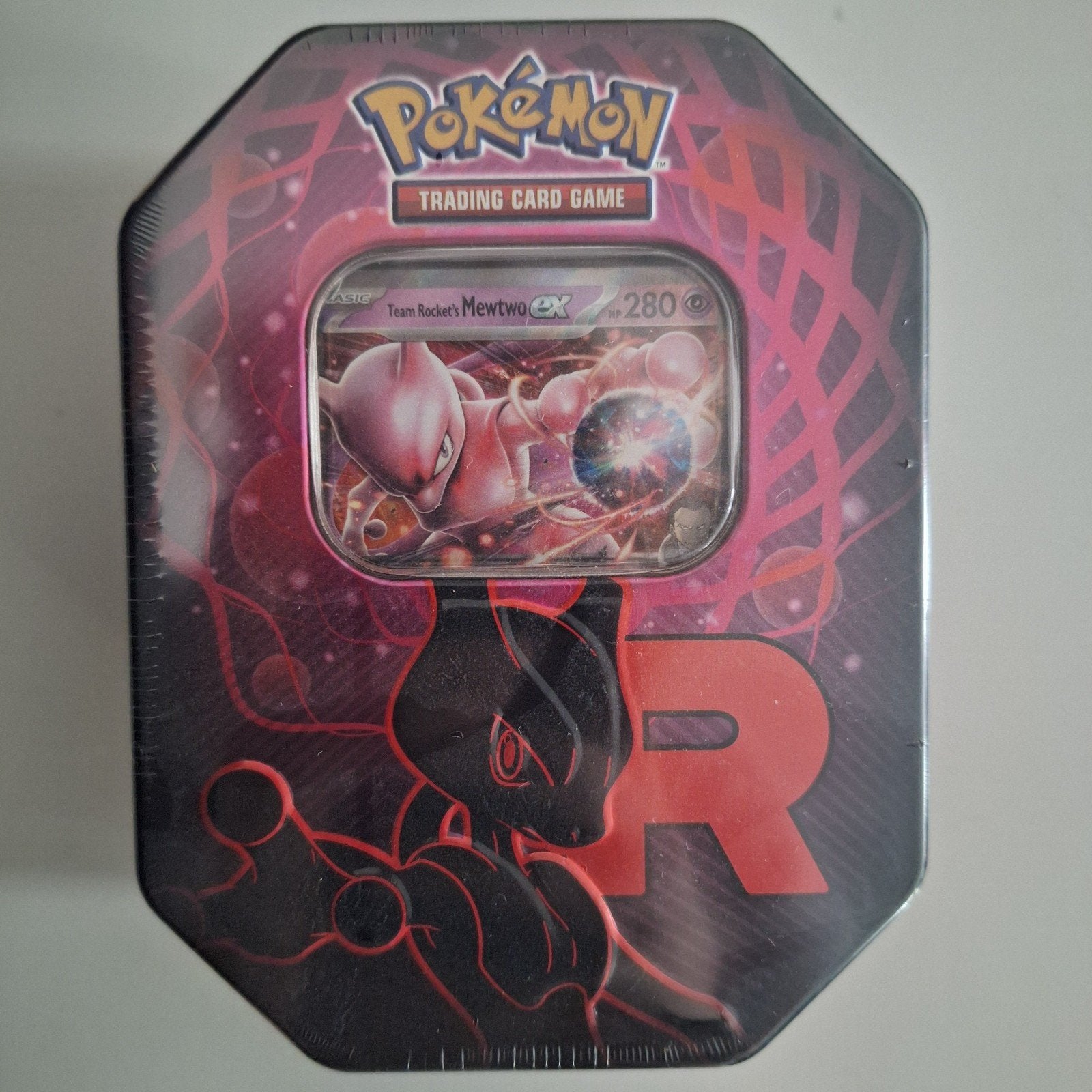 Pokémon Mewtwo tin team rocket, Hobby en Vrije tijd, Ophalen of Verzenden, Nieuw, Booster, Foil