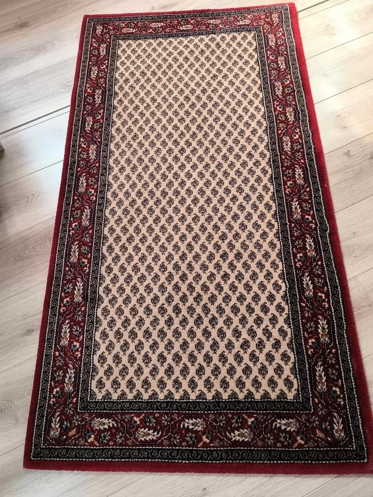 Handgemaakte Perzisch tapijt, Ophalen