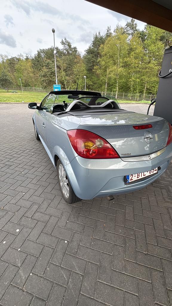 Opel tigra 1.3 te koop, Auto's, Zwart, Cabriolet, Blauw, Leder en Stof