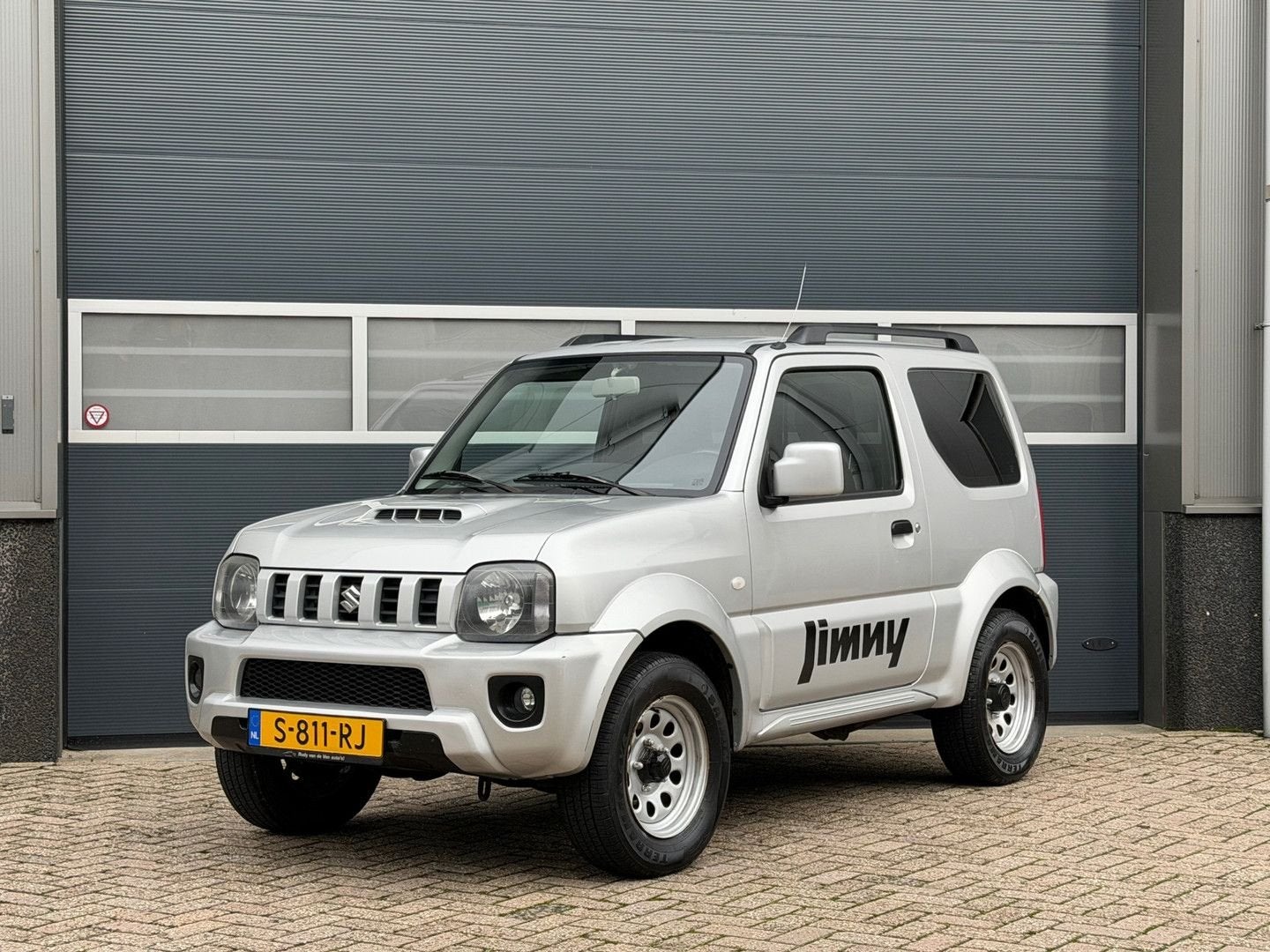 Suzuki Jimny 1.3 JLX bj.2014 Airco|4Wd|Trekh|Stoelverw., Auto's, 63 kW, Handgeschakeld, Grijs, Elektrische ramen