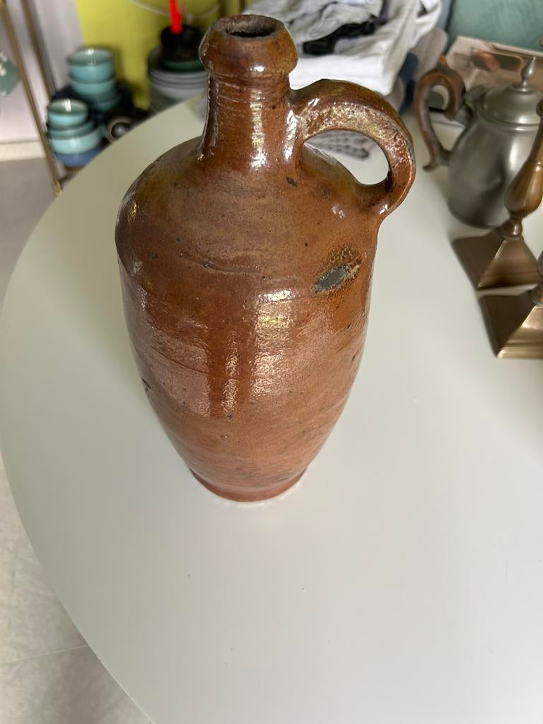 Oude jeneverkruik in aardewerk, Ophalen
