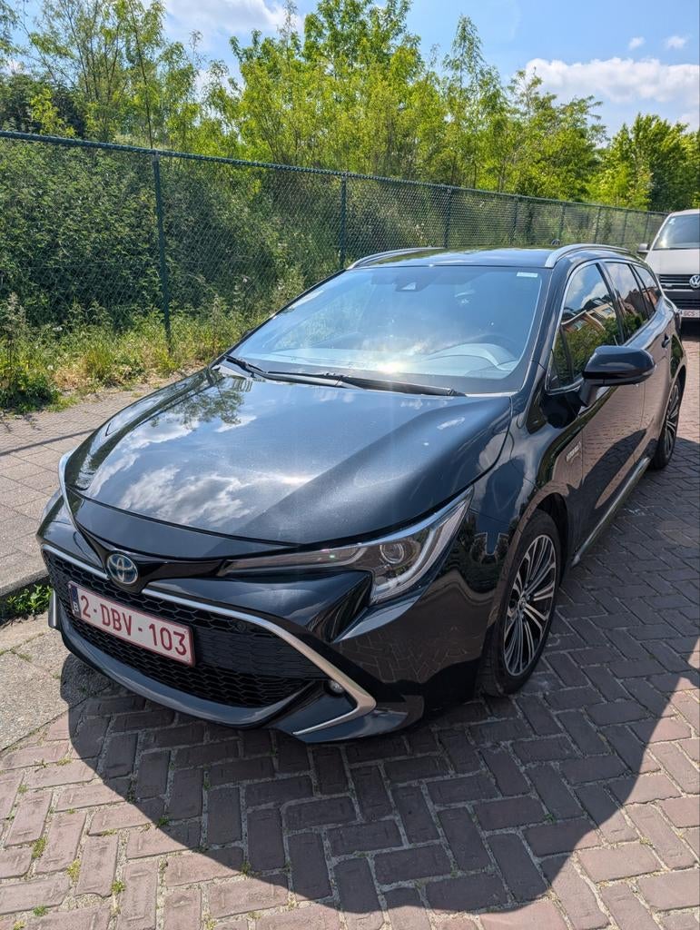 Toyota Corolla Touring Sport Hybrid 1.8 met Garantie, Leder en Stof, Zwart, Break, 5 deurs