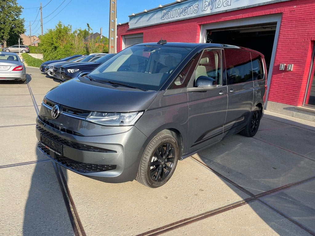 Volkswagen T7 Multivan 1.4 TSI PHEV EDITION PANO CAMERA 18", Auto's, Volkswagen, Stof, Gebruikt, 4 cilinders, 7 zetels