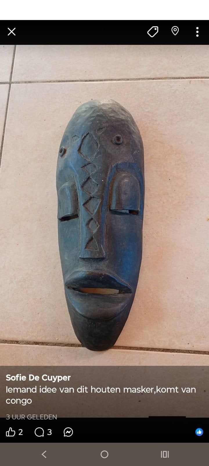 Masker afkomstig  uit Congo, Ophalen