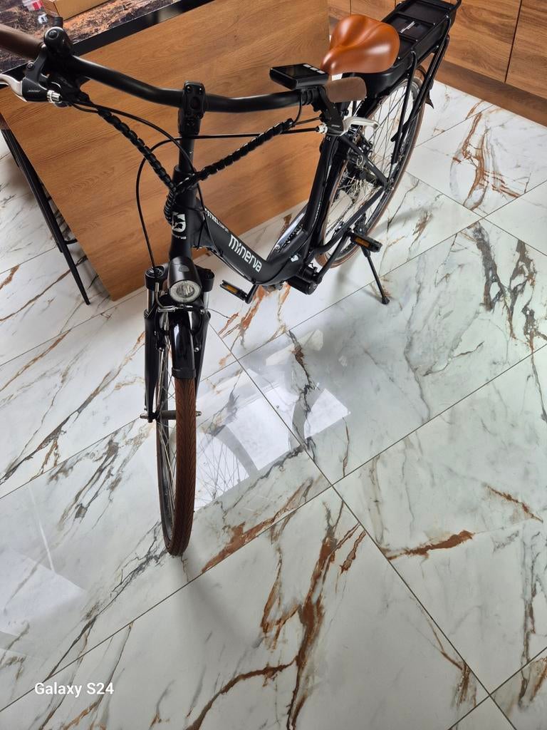 Elektrische fiets middenmotor minerva 2 jaar oud, Ophalen, Zo goed als nieuw, 50 km per accu of meer