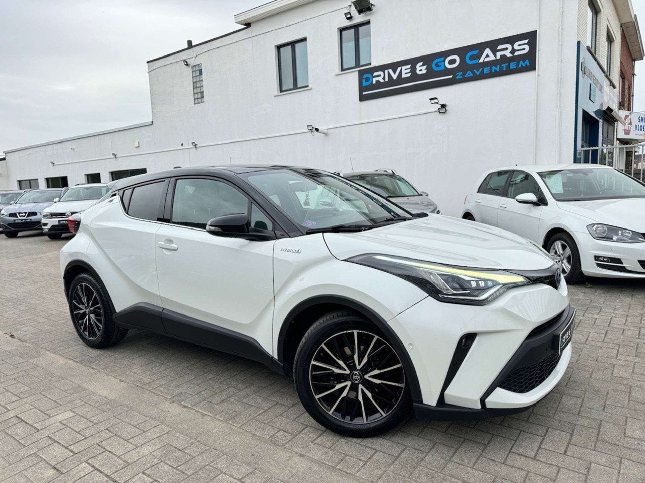 Toyota C-HR Hybrid 1.8i VVT-i C-Lub E-CVT * 4 JAAR GARANTIE, Auto's, Lichtsensor, Gebruikt, 4 cilinders, 72 kW