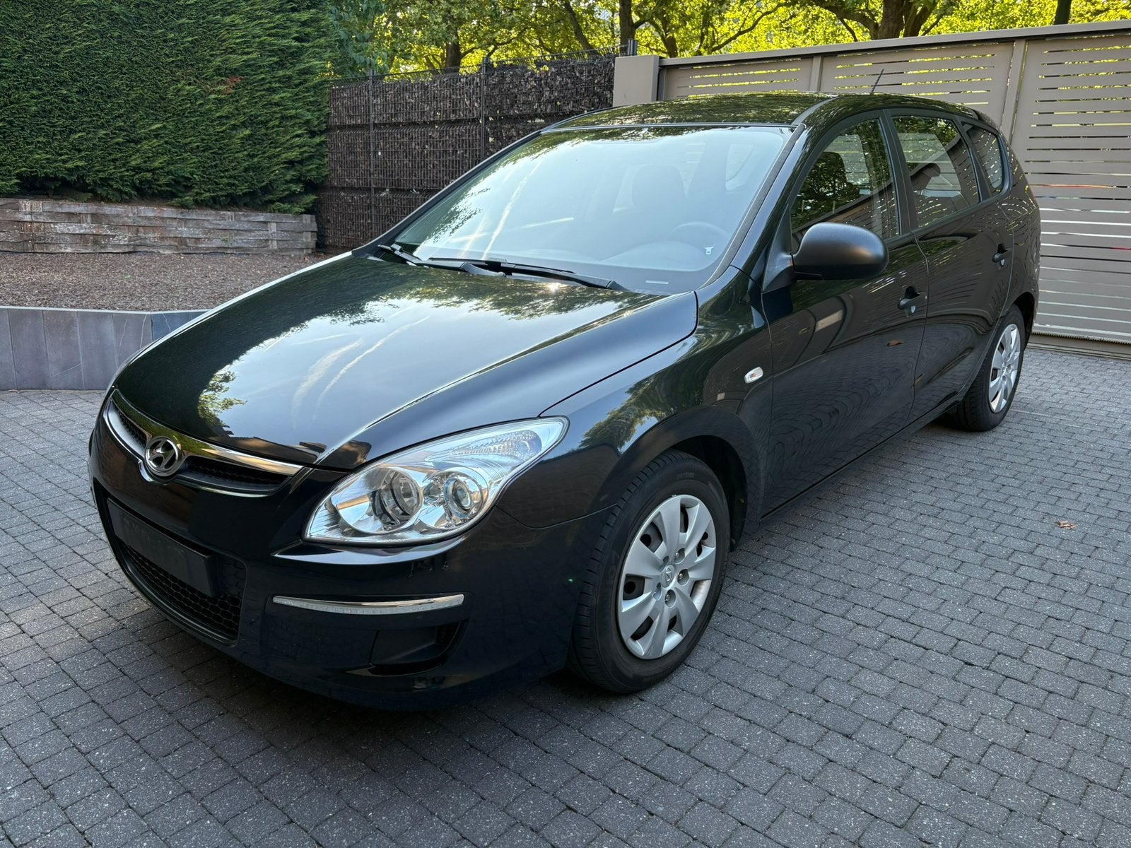 Hyundai i30 stationwagon 1.6 benzine eerste eigenaar, Auto's, Stof, 1599 cc, 4 cilinders, Zwart