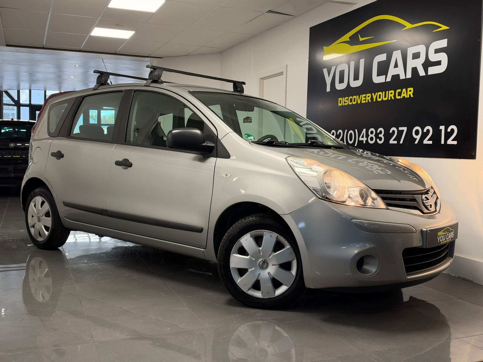 Nissan Note 1.4i Connect Edition 1 Jaar Garantie, Auto's, Stof, Gebruikt, Zwart, 4 cilinders