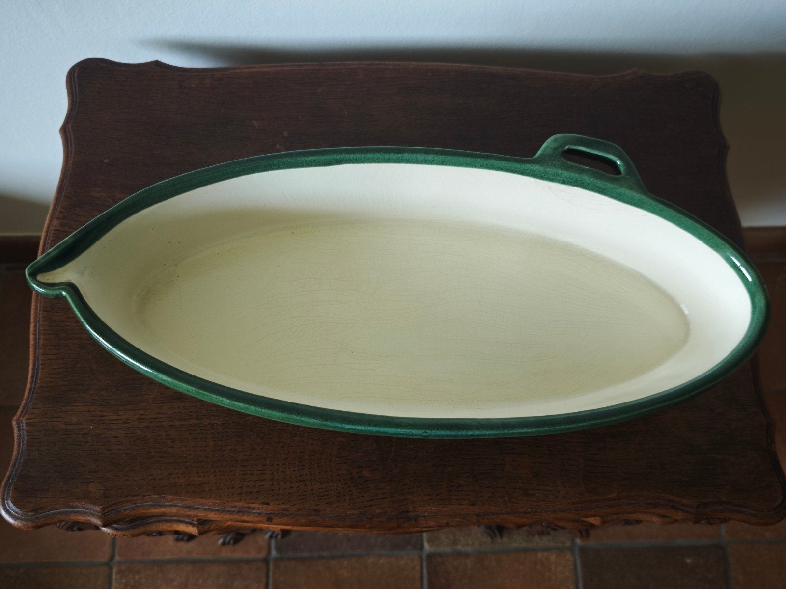 Plat allant au four vert et blanc, Enlèvement