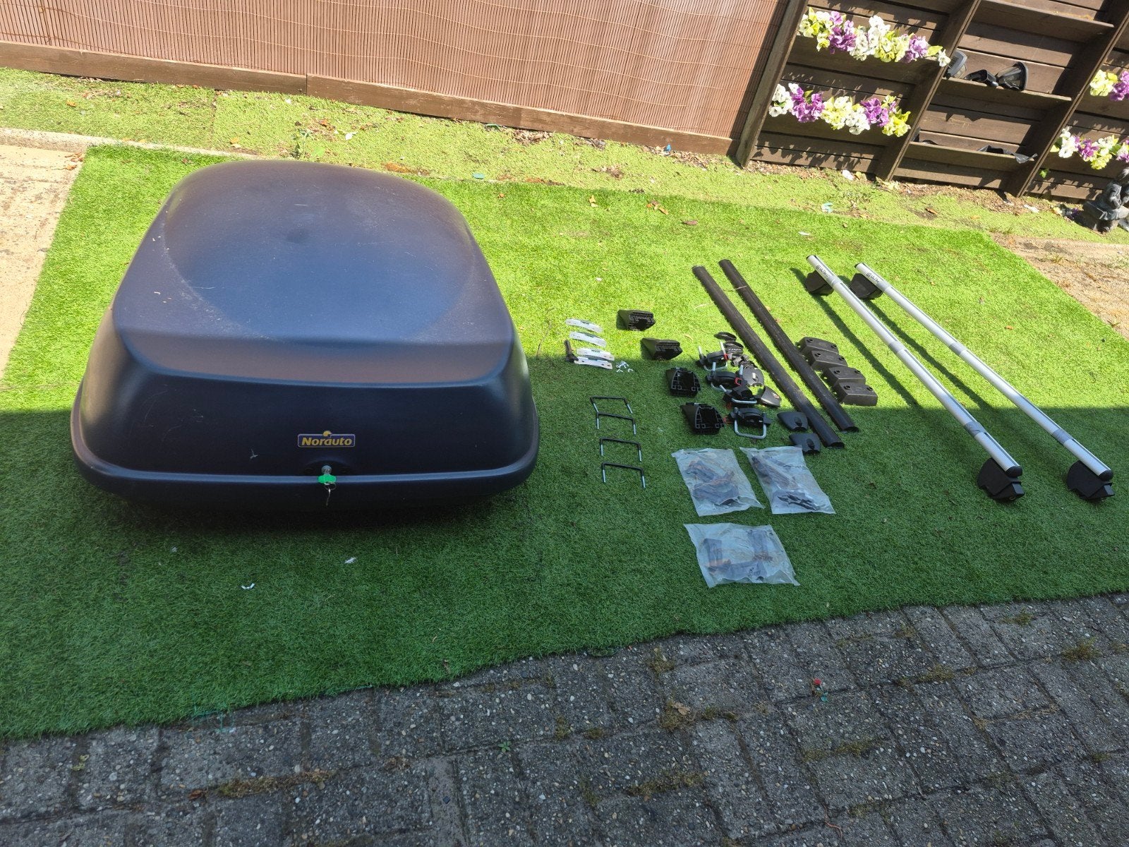 Dakkoffer voor alle auto's, Ophalen