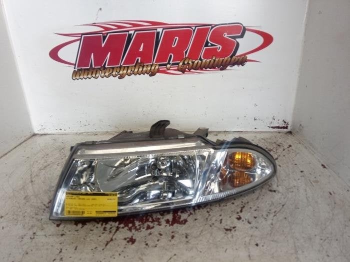 Koplamp links van een Mitsubishi Carisma, Auto-onderdelen, Gebruikt, -, -, Mitsubishi