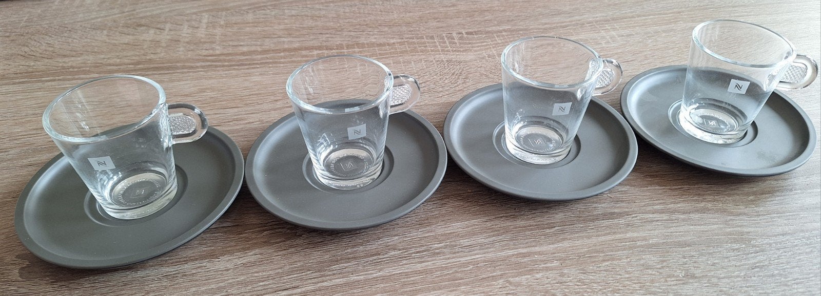 Set van 4 kopjes en schoteltjes uit de Nespresso collectie, Ophalen of Verzenden, Glas