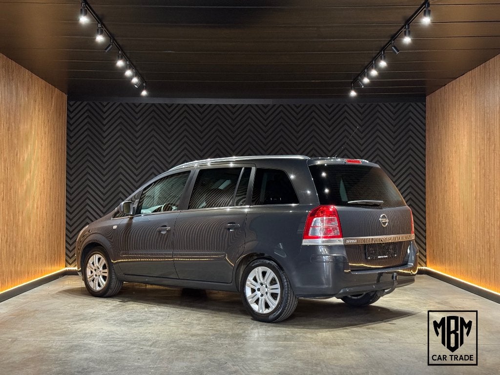 ✅Opel Zafira 1.6i GARANTIE 7 Zits Airco Trekhaak Parkeersens, Voorwielaandrijving, Zwart, 4 cilinders, 7 zetels