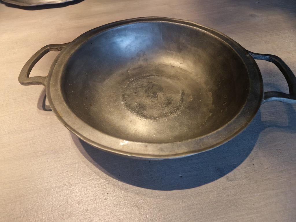 Tinnen schotel, Ophalen